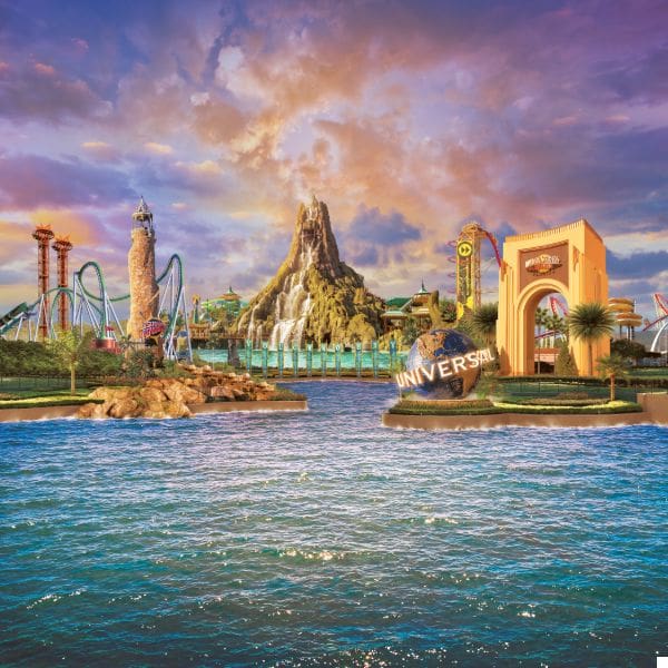 a vibrant scene of an amusement park with a large, central volcano, roller coasters, and an iconic globe structure. the water in the foreground reflects the colorful sunset sky, creating a lively and inviting atmosphere.